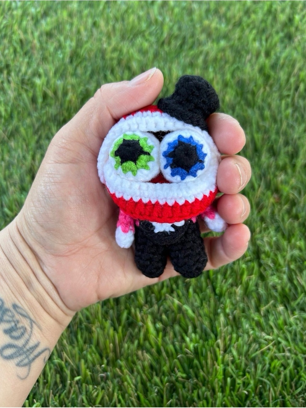 Handmade Black and Red Crochet Stuffed Toy with Blue & Green Eyes